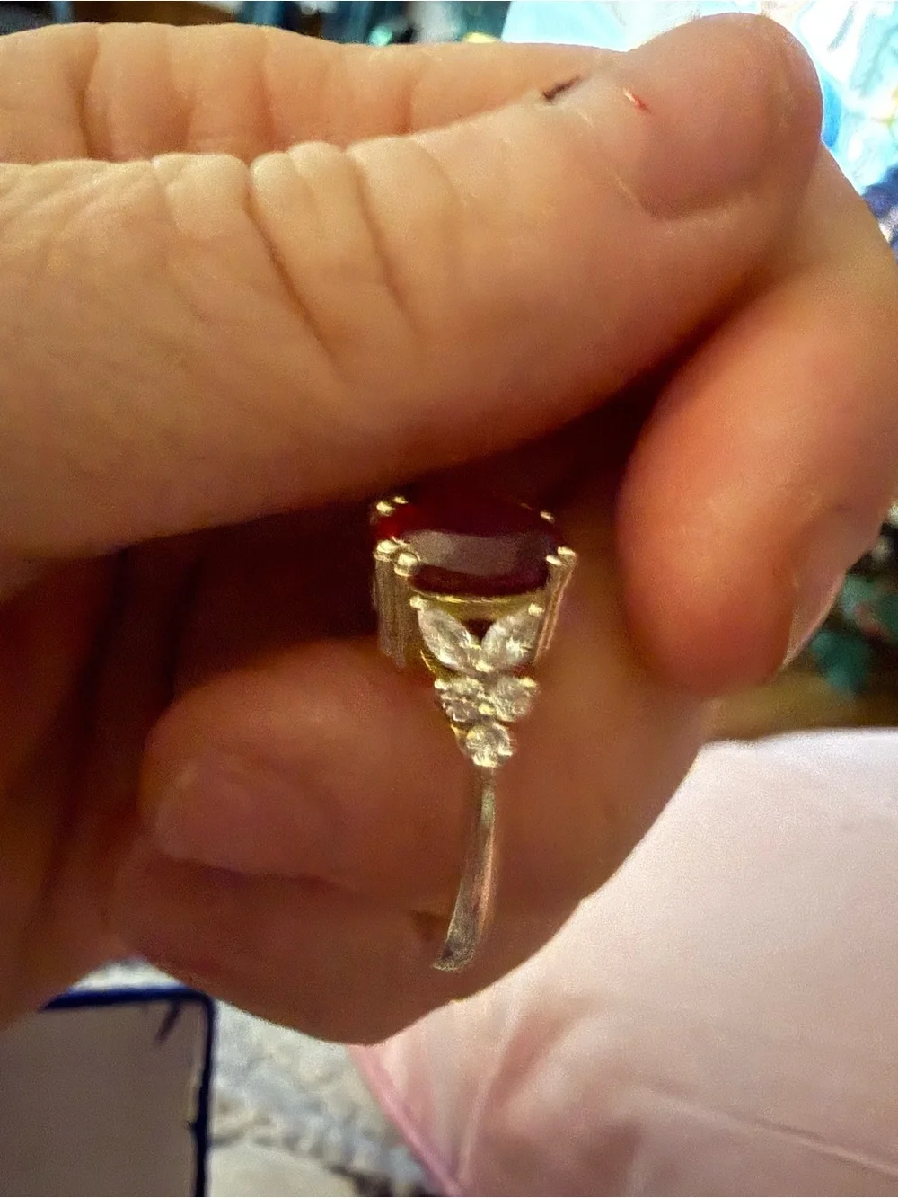 Natural Garnet ring with white sapphires on each side.